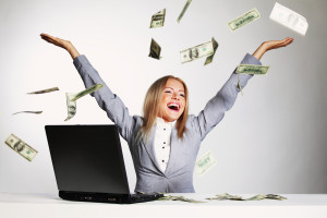 bigstock-business-woman-drop-dollars-in-25447745